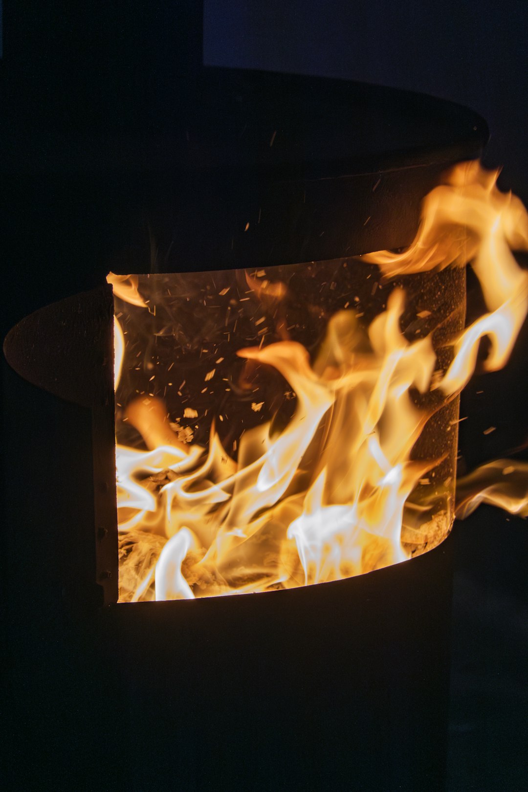 a-fire-burning-inside-of-a-black-container-q0g0z2yp6c8